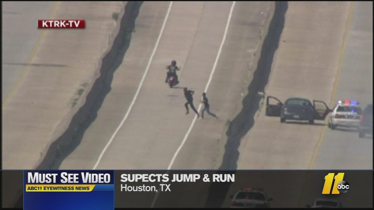 Must See Videos Car chase suspects run across freeway
