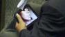 Indonesian parliament member from Prosperous Justice Party (PKS) Arifinto watches a porn video on his tablet computer.