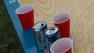 College students playing beer pong.