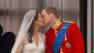 Prince William and Kate Middleton exchange a short kiss on the Buckingham Palace balcony.