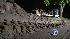 Crews work to clear off mud slide mess
