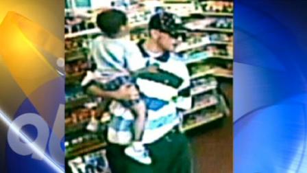 Alleged armed robber w/ boy in arms arrested