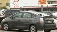 A Toyota Prius sits at a dealership in California.