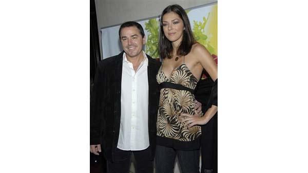 Actor Christopher Knight, left, and model Adrianne Curry pose on the press line at the Sashi restaurant opening in Manhattan Beach, Calif. on Aug. 28, 2008. Okuwa is best known for his appearance on the television series 'Iron Chef'.