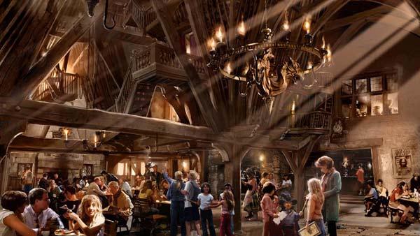 The Three Broomsticks and adjacent Hog's Head pub will feature traditional British fare and drinks including Butterbeer and pumpkin juice. (Early conceptual rendering of The Three Broomsticks, located in Hogsmeade)