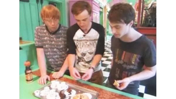 Rupert Grint (Ron Weasley), Tom Felton (Draco Malfoy) and Daniel Radcliffe (Harry Potter) enjoy candy at 'The Wizarding World of Harry Potter,' which opened at Universal Studios in Orlando, Florida on June 18, 2010.