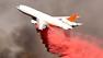 A DC-10 air tanker dropped about 12,000 gallons of Phos-Chek along a ridgeline to stop the fire from advancing toward Acton.
