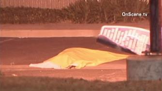 A driver lost control in Santa Ana late Wednesday night, slamming into a woman standing on the sidewalk and killing her.
