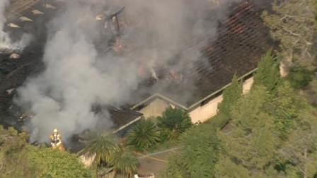 Los Angeles County Fire was called to a home in Whittier with a report of flames showing from the roof.
