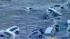 Waves wash cars away after Japan quake :: TV footage shows cars being washed away after a tsunami hits following the massive earthquake in Japan.