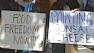 Protesters gathered in downtown L.A. where a Venice market owner faces charges of selling unlicensed raw milk.