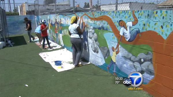 A group of teens in South Los Angeles spent Saturday, August 20, 2011 helping paint a mural at 'A Place Called Home.'