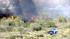 With the high heat, a brush fire broke out in the Santa Ana River Bed, burning at least 10 acres.