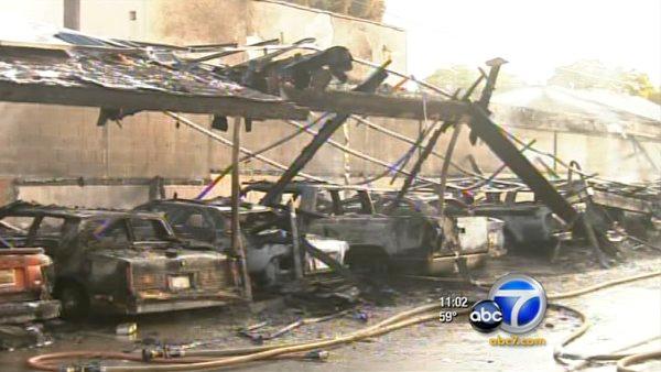 A fire in a carport in Whittier destroyed at least 21 cars and damaged as many as 19 more on Wednesday, Nov. 23, 2011.