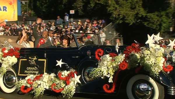 Grand Marshall J.R. Martinez waves to the crowd on Orange Grove Boulevard during the 123rd annual Rose Parade in Pasadena Jan. 2, 2012.