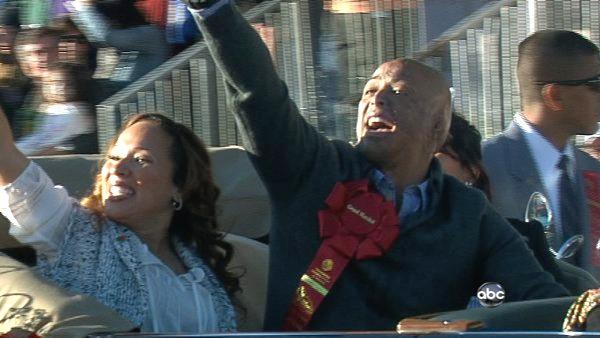Grand Marshall J.R. Martinez waves to the crowd on Orange Grove Boulevard during the 123rd annual Rose Parade in Pasadena Jan. 2, 2012.