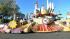 A float passes the crowd on Orange Grove...