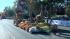 A float passes the crowd on Orange Grove...