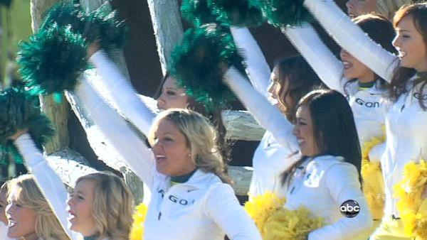 The Oregon State cheerleaders wave to the crowd from their float on Orange Grove Boulevard during the 123rd annual Rose Parade in Pasadena Jan. 2, 2012.