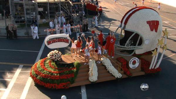 The University of Wisconsin cheerleaders wave to the crowd from their float on Colorado Boulevard during the 123rd annual Rose Parade in Pasadena Jan. 2, 2012.