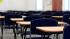 Desks in a classroom are shown in this undated file photo.