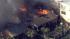 Firefighters are battling a fire at a house...