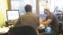 An H&R Block tax professional is seen helping a customer in this undated file photo.
