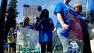 Low-income families marched around the Capitol to protest the proposed $500 million dollar cut to subsidized childcare.
