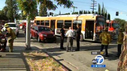 Authorities are seen at the site of an MTA bus crash in West Hills on Saturday, June 2, 2012.