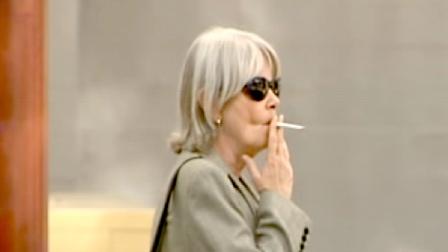 A woman is seen smoking on the street in this undated photo.