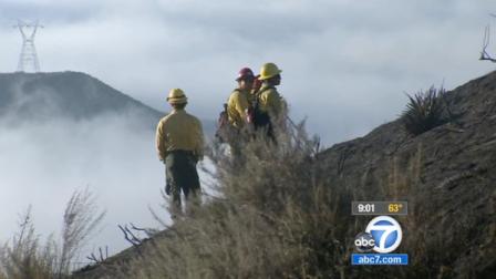 Crews in Castaic are still working Saturday to contain a brush fire, which police say was started by a motorcycle crash.