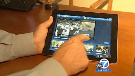 An iPad user is seen using the new ABC7 Los Angeles iPad app.