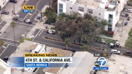 Police are seen near Third and Fifth streets at California Avenue in Santa Monica during a search for a burglary suspect Friday, June 15, 2012.