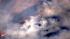 An aerial shot shows part of a major brush fire...