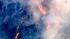 An aerial shot shows part of a major brush fire...