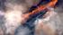 An aerial shot shows part of a major brush fire...