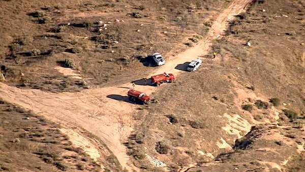 An aerial shot shows fire crews on the ground near a major brush fire in Beaumont on Saturday, June 16, 2012. The fire burned over 1,000 acres in a matter of five hours.