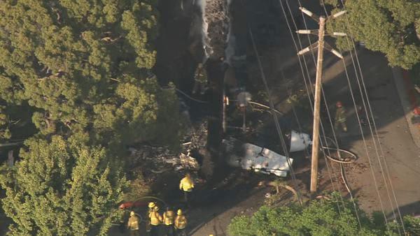 Crews are seen at the site of a small plane crash in Westwood on Friday, August 10, 2012. One person was reported dead at the scene.