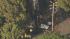 Crews are seen at the site of a small plane...