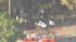 Crews are seen at the site of a small plane...