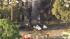 Crews are seen at the site of a small plane...