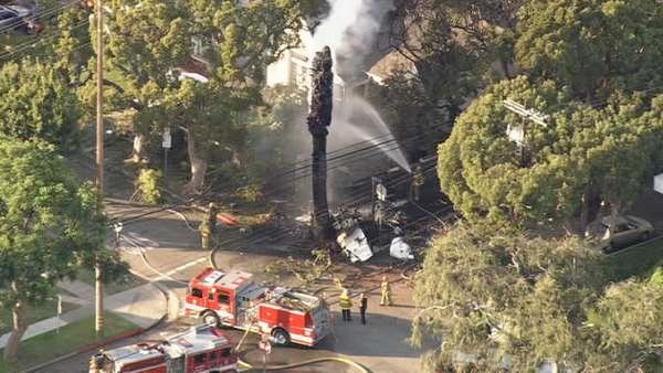 Crews are seen at the site of a small plane crash in Westwood on Friday, August 10, 2012. One person was reported dead at the scene.