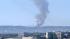 Smoke is seen from LAX after a brush fire burned...