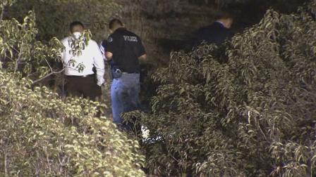 Authorities investigate in Irwindale after a headless human body was found on Thursday, Feb. 13, 2014.