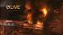 A J.J. Newberry store is seen on fire after a...