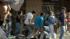 Looters are seen fleeing from businesses during...