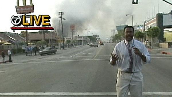 ABC7's Marc Brown is seen reporting live near the scene of a fire during the 1992 L.A. riots.