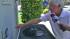 A man is seen pointing to his smart meter at his Arcadia, Calif. home in this undated file photo.