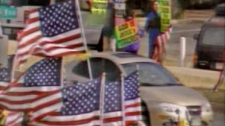 People are seen protesting outside a funeral service in this undated file photo.