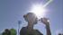 Santa Clarita copes with sweltering heat :: A woman is seen drinking water in the sun at the College of the Canyons in Santa Clarita on Tuesday, Oct. 2, 2012.